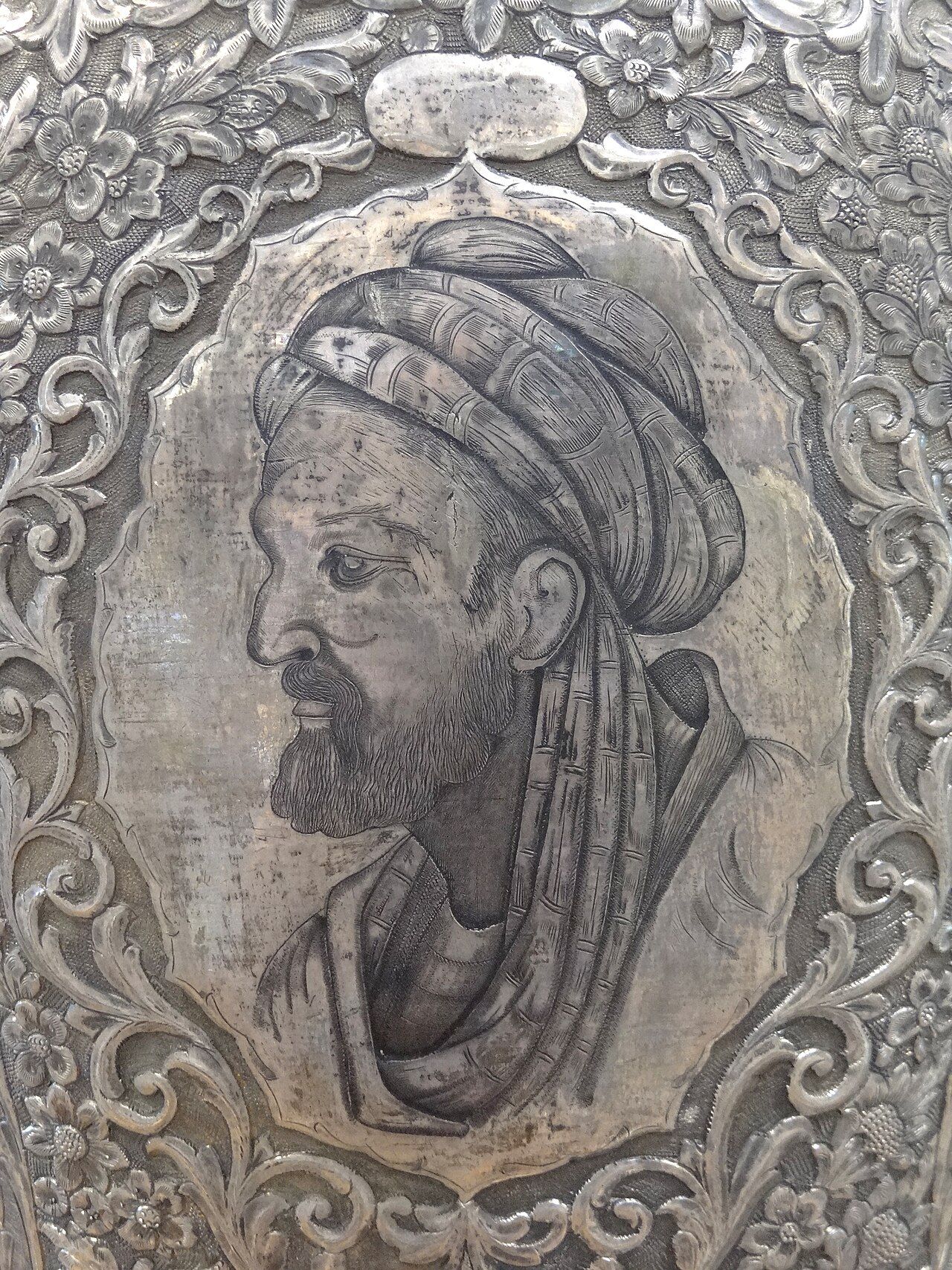 Engraved silver relief of a bearded man in a turban, in profile