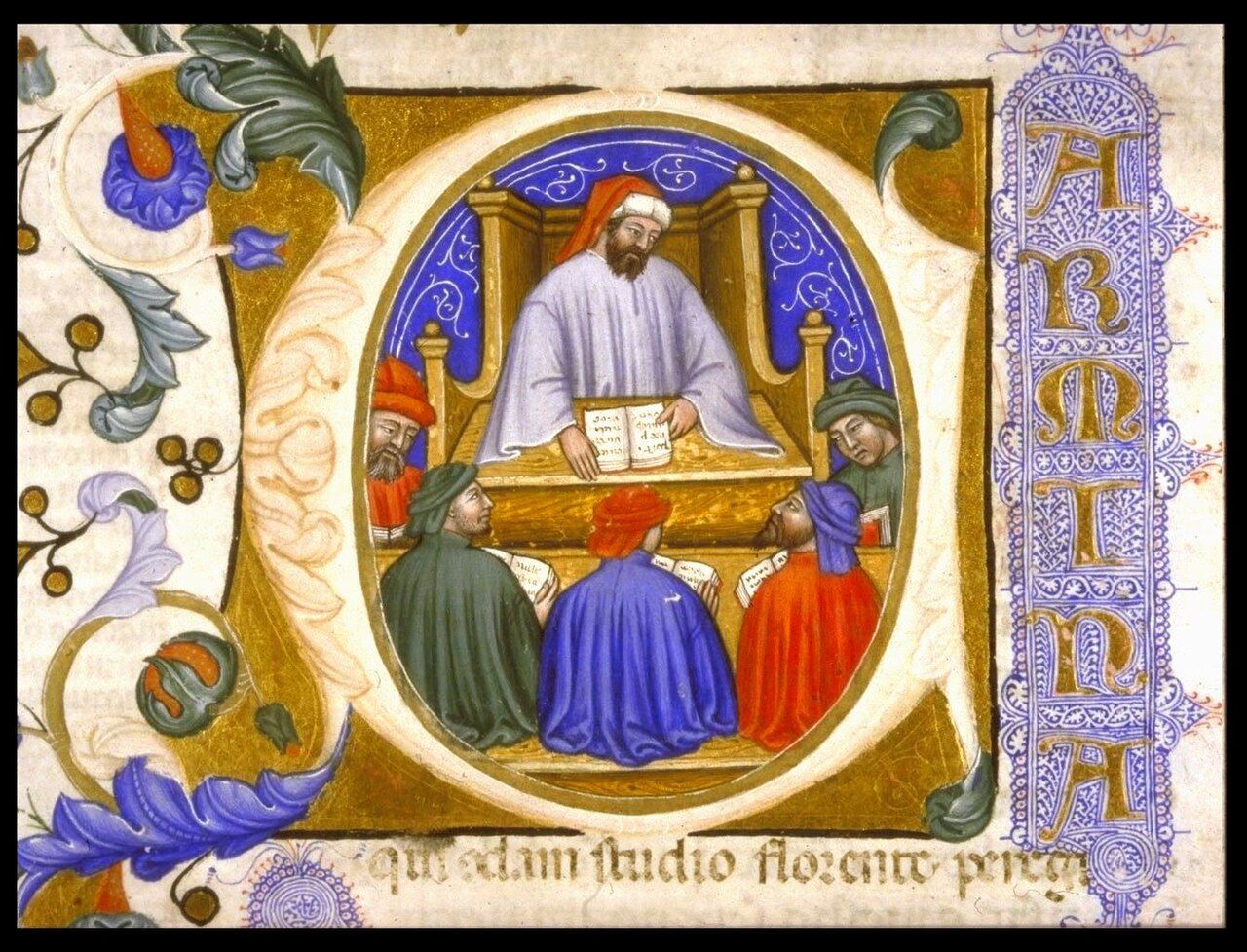 Illuminated initial showing a bearded teacher in a lilac robe reading from a lectern to seated students