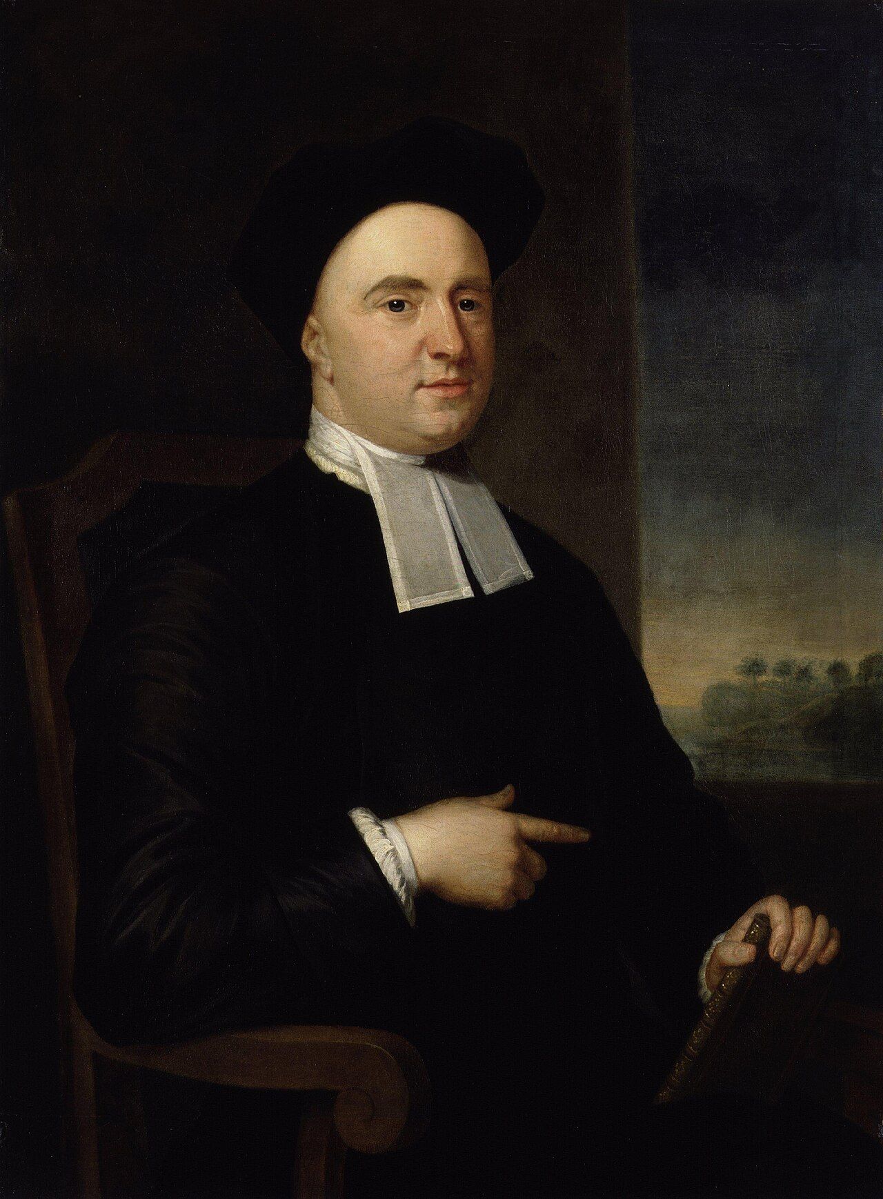 Painted portrait of a man in a black cap and clerical dress with white bands, pointing with one hand