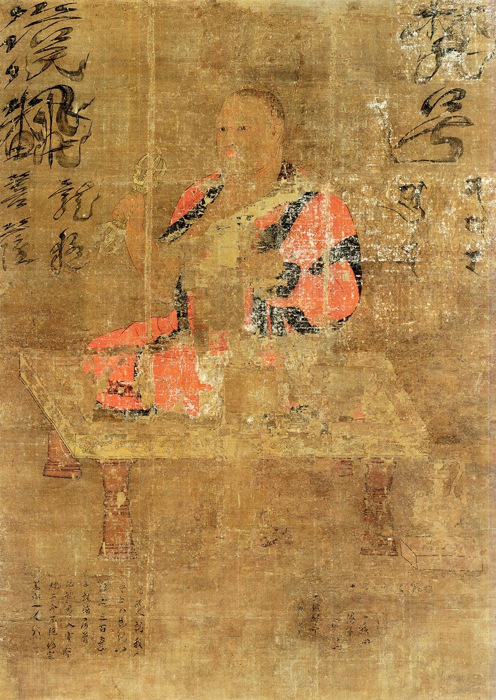 Faded painting of a seated monk in orange robes holding a ritual implement, beside calligraphy