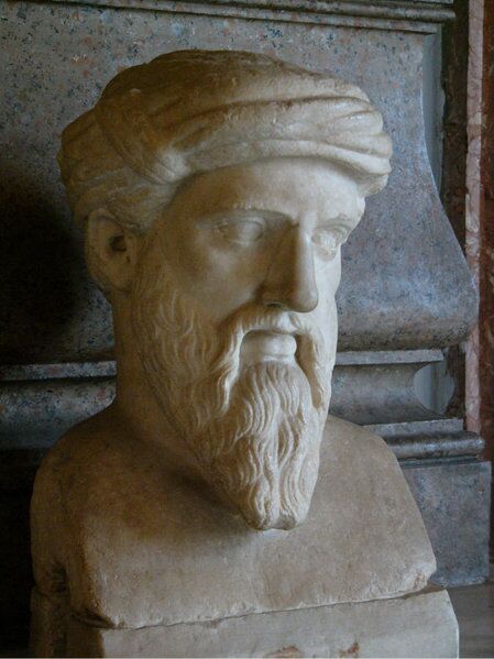 Marble bust of a bearded man wearing a turban-like head covering