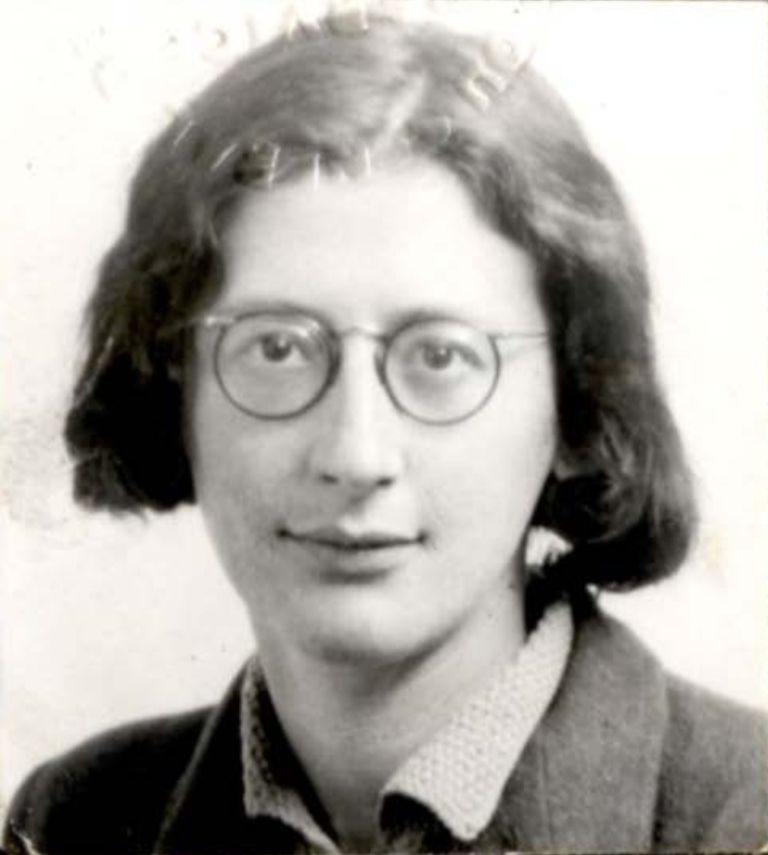 Identity photograph of a young woman with short dark hair and round glasses