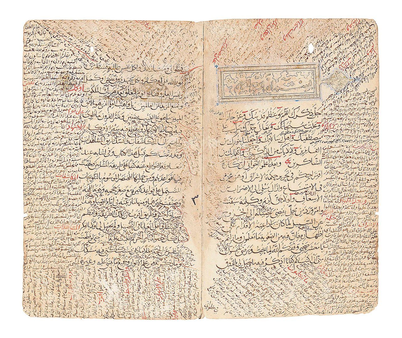 Open manuscript in Arabic script with a decorated heading