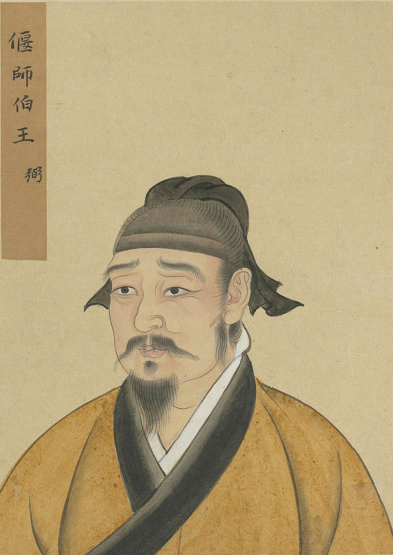 Painted bust of a man with a moustache and pointed beard, in a dark cap and a yellow robe with a black collar
